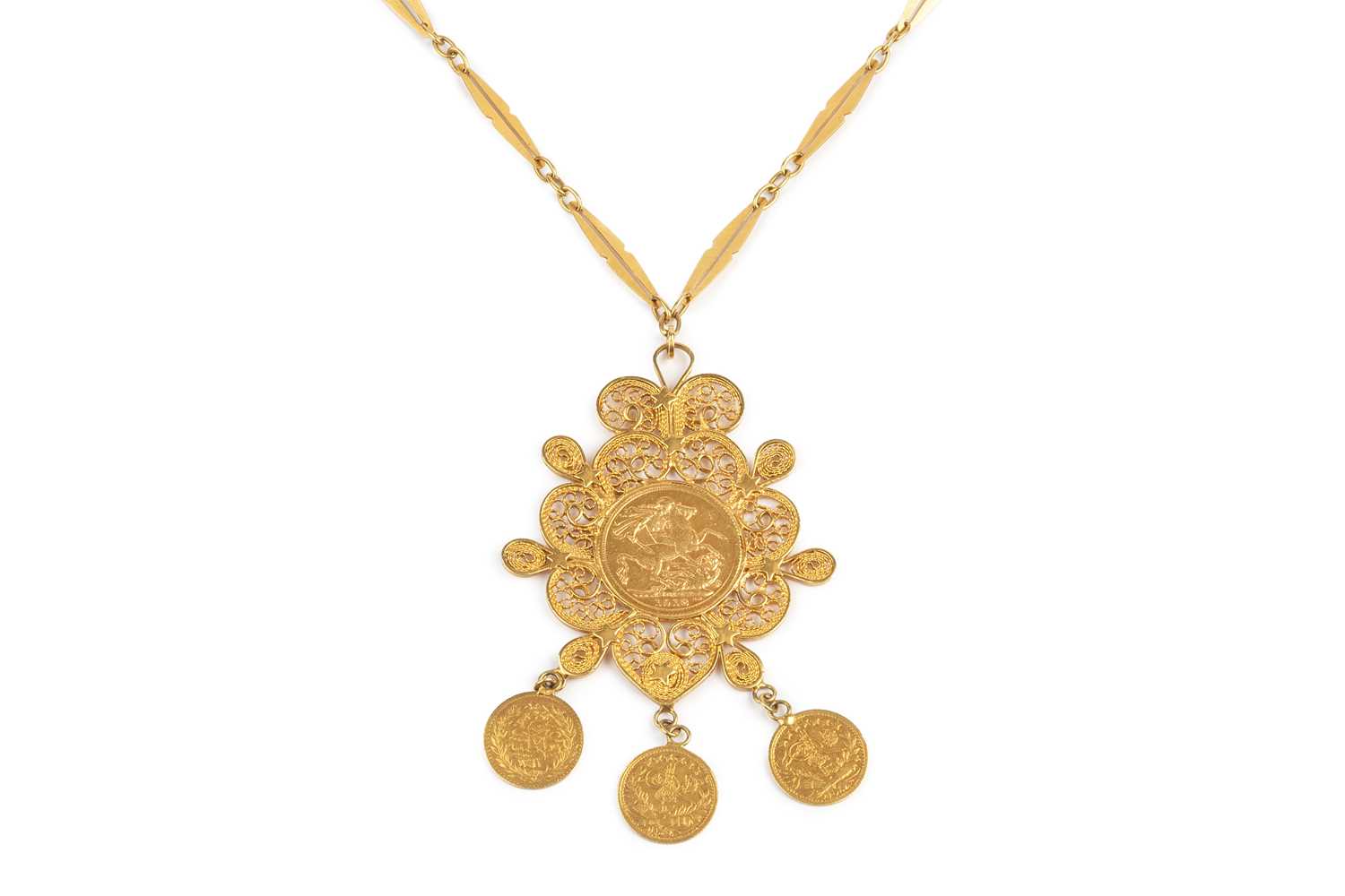 Lot 228 - A sovereign set pendant on chain, the filigree...