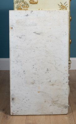 Lot 488 - A cream painted chest of drawers with a marble top