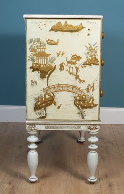 Lot 488 - A cream painted chest of drawers with a marble top