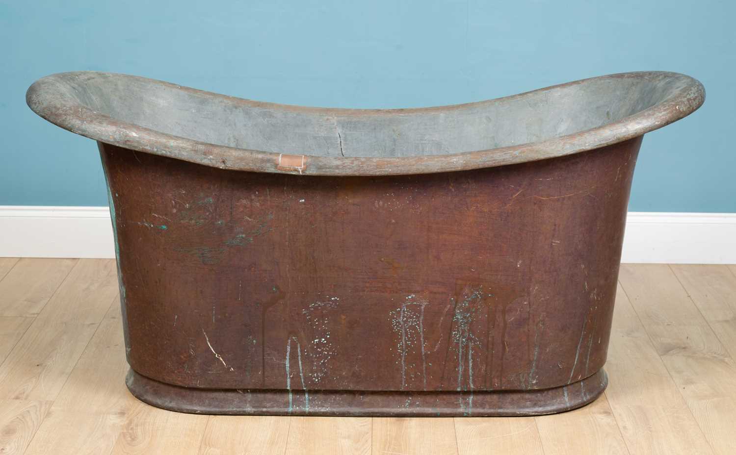 Lot 1179 - An antique 19th century roll top patinated copper bath