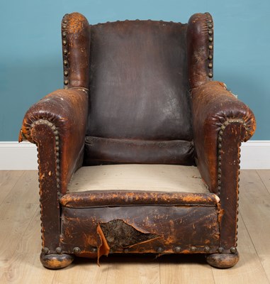 Lot 317 - A 19th century leather wingback armchair