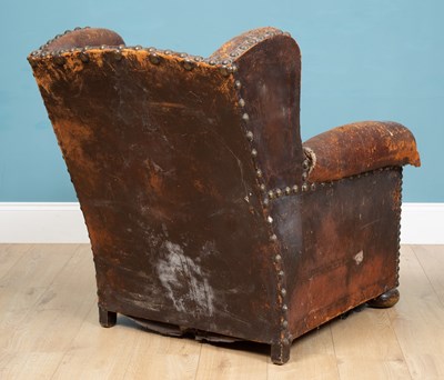 Lot 317 - A 19th century leather wingback armchair