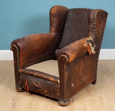 Lot 298 - A 19th century leather wingback armchair