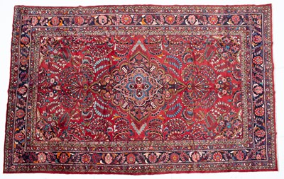 Lot 1065 - A Middle Eastern Lilihan red ground rug