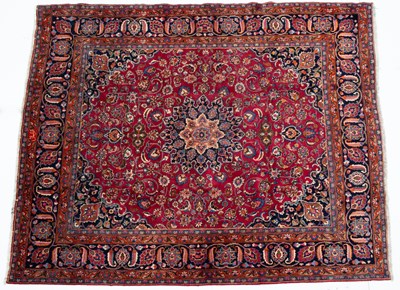 Lot 1070 - A Middle Eastern Meshed red ground carpet