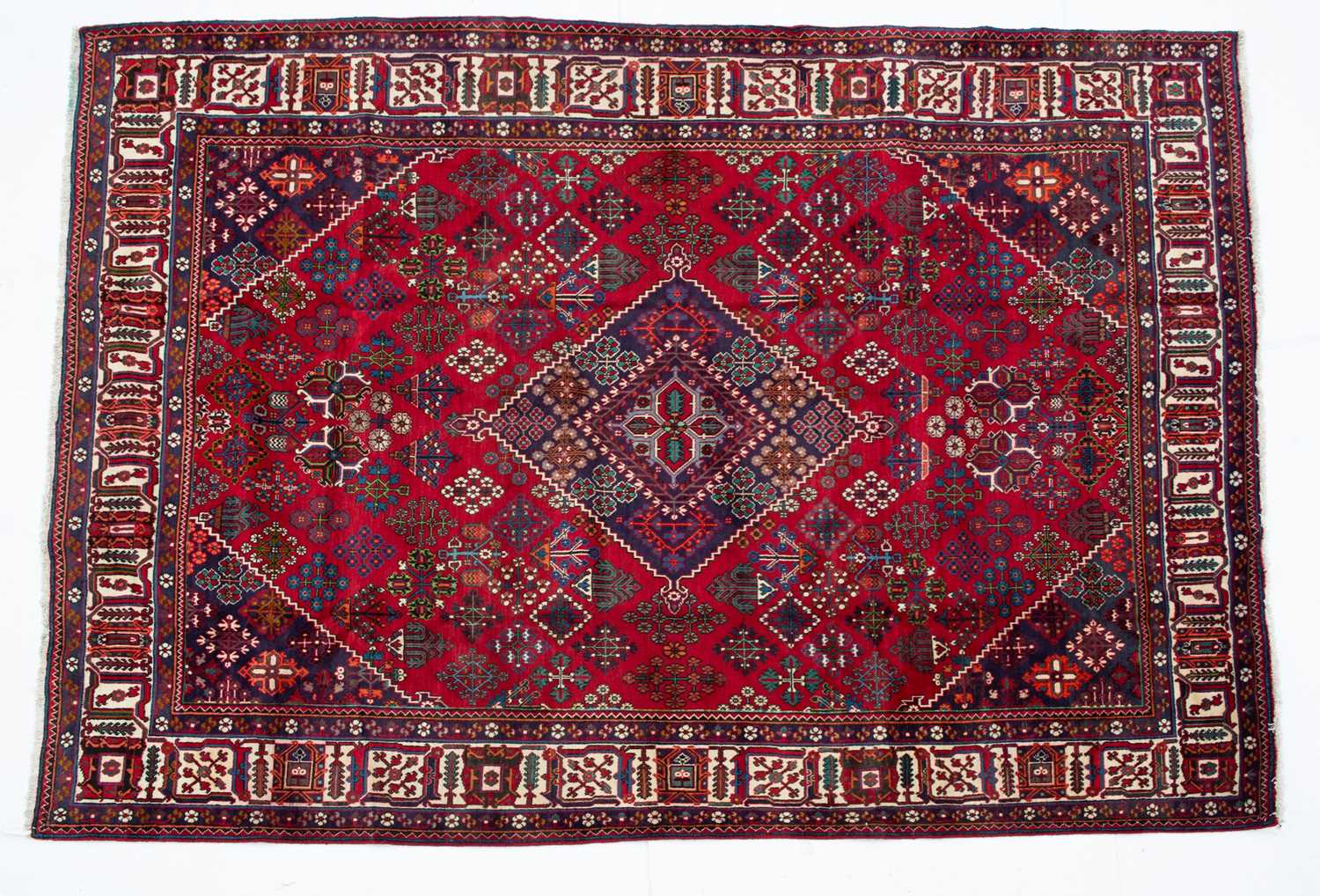 Lot 1069 - A Middle Eastern Meimeh red ground rug