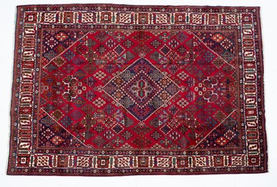 Lot 1069 - A Middle Eastern Meimeh red ground rug