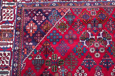 Lot 1069 - A Middle Eastern Meimeh red ground rug