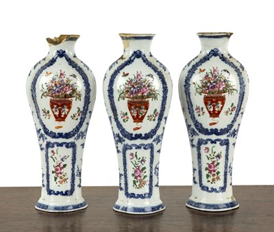 Lot 434 - Three piece garniture of famille rose vases...