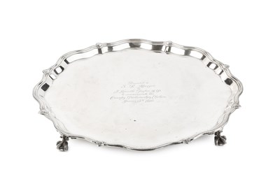 Lot 849 - An Edwardian silver salver, with shaped and...