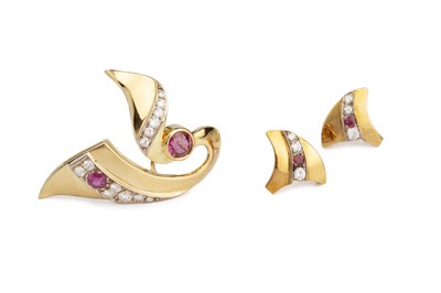 Lot 131 - A ruby and diamond brooch and ear studs suite,...