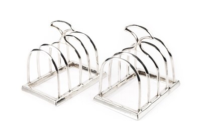 Lot 840 - A pair of George V silver five bar toast racks,...