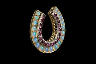 Lot 110 - A Victorian ruby and opal horseshoe brooch,...