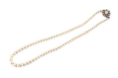 Lot 239 - A cultured pearl necklace with gem set clasp,...