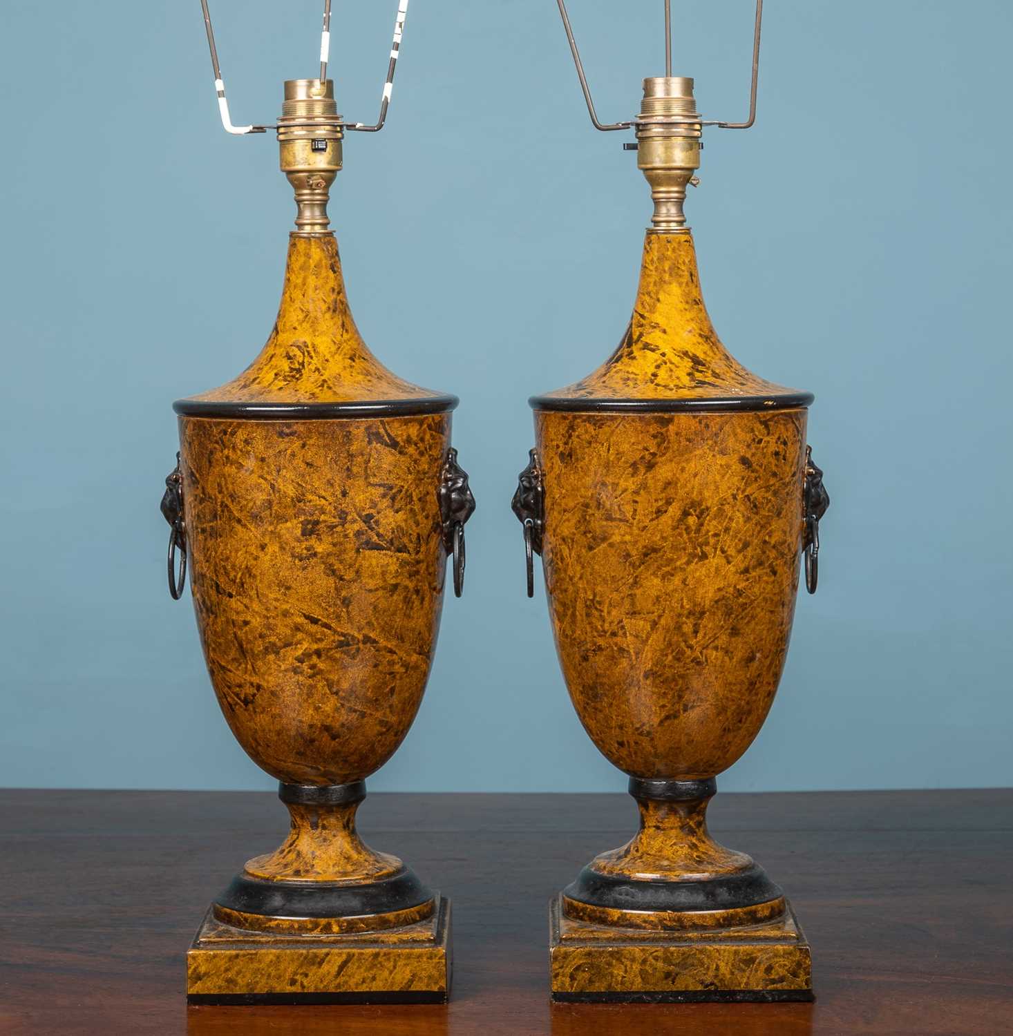 Lot 92 - A pair of toleware table lamps