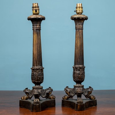 Lot 125 - A pair of cast brass table lamps