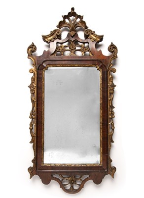 Lot 100 - A George III rosewood wall mirror with carved...