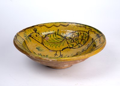 Lot 119 - A 19th century north African slipware bowl...