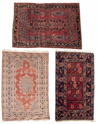 Lot 1046 - A Persian wine ground rug