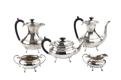 Lot 823 - A George V silver five-piece tea and coffee...