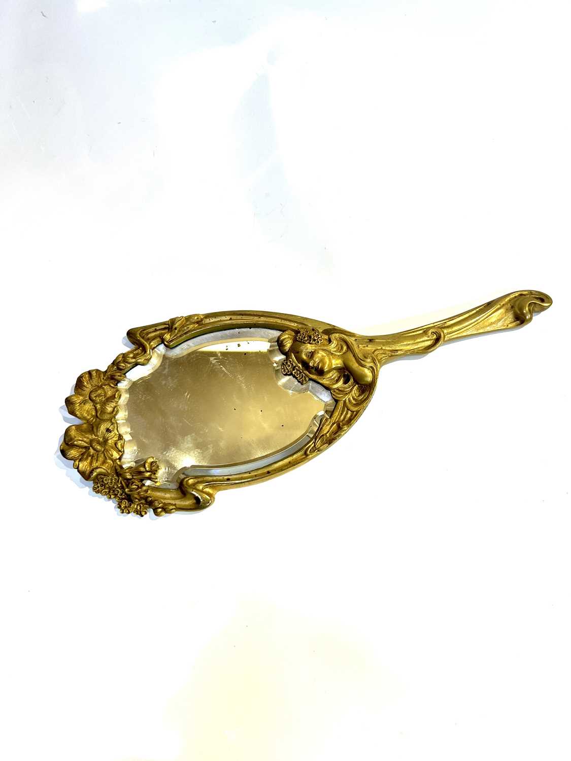 Lot 667 - Art Nouveau Hand mirror modelled with a girl...