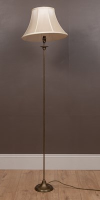 Lot 204 - A tall thin modern brass floor standing lamp