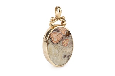 Lot 12 - A hardstone pendant by Jack Spencer, inset to...