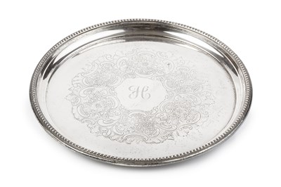 Lot 844 - A silver circular tray, with beaded border and...