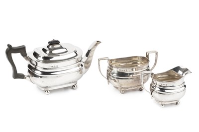 Lot 828 - A George V silver three piece tea service, of...