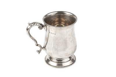 Lot 829 - A George V silver baluster pint mug, with leaf...