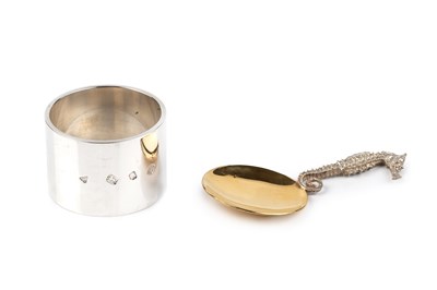 Lot 564 - A modern silver-gilt caddy spoon, the handle...