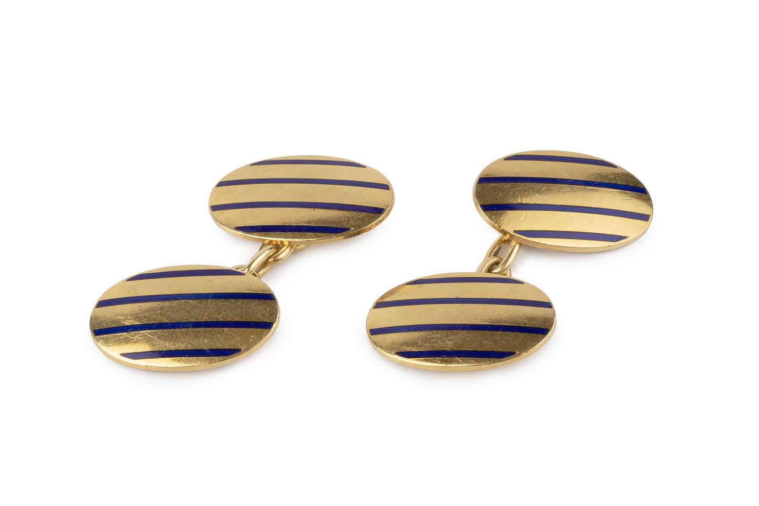 Lot 10 - A pair of enamel cufflinks, each oval panel...