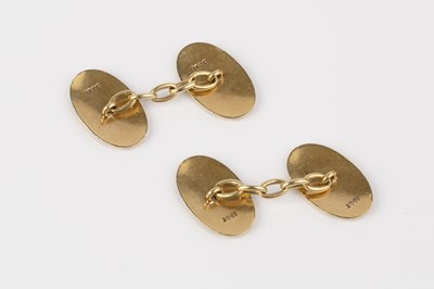 Lot 10 - A pair of enamel cufflinks, each oval panel...