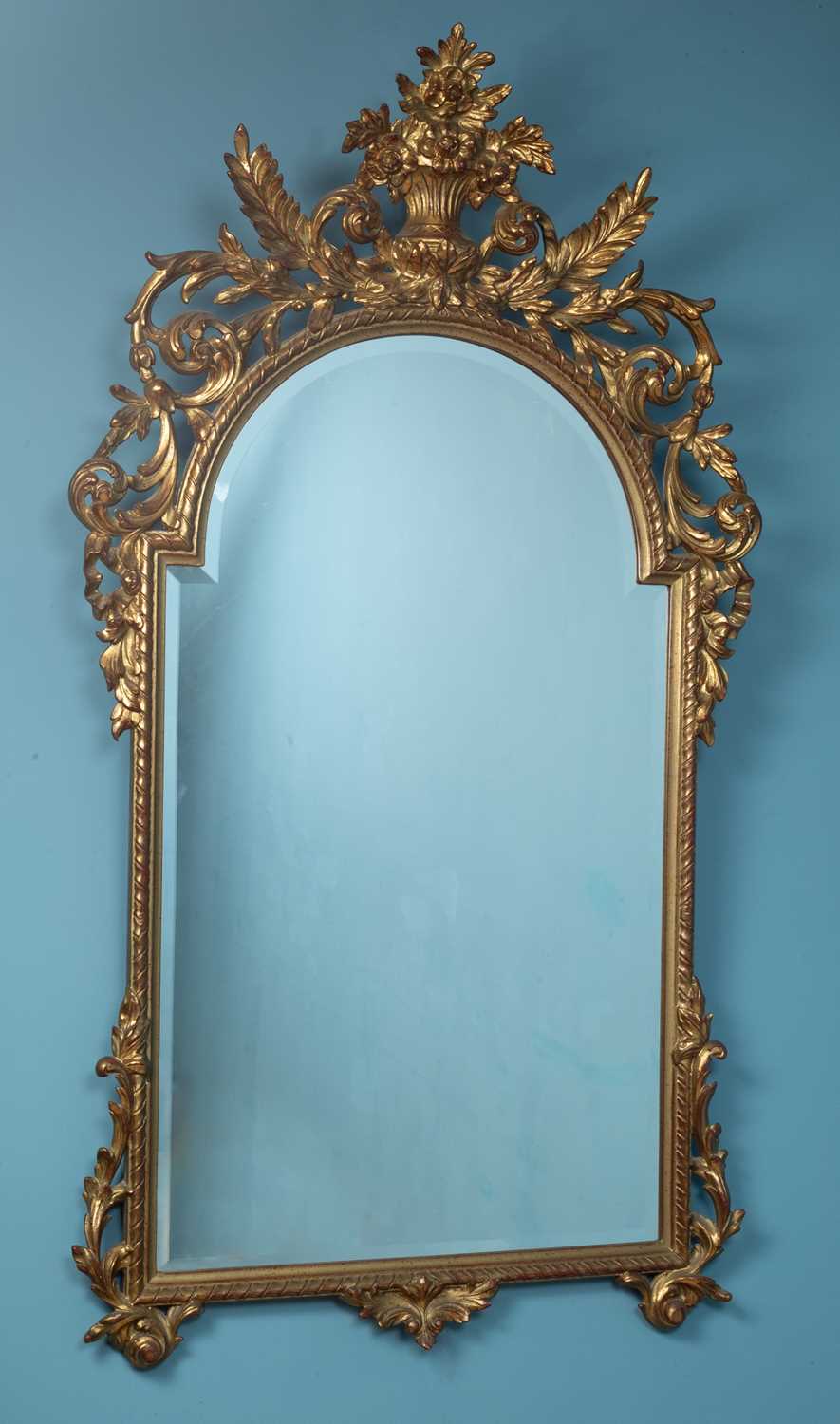 Lot 98 - An 18th century Baroque style giltwood mirror