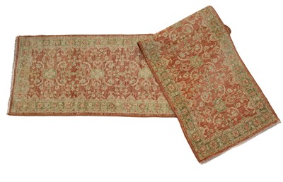 Lot 1054 - A late 20th century Persian style cream, red and green ground woolen runner