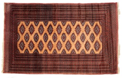 Lot 1045 - A Persian style red ground woolen rug