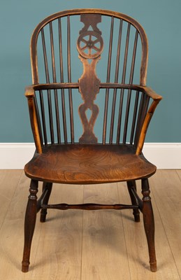 Lot 373 - An antique ash and elm Windsor armchair