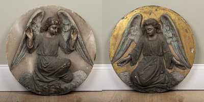 Lot 387 - A pair of carved alabaster roundels