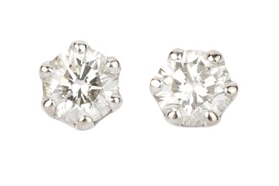 Lot 85 - A pair of diamond single stone ear studs, each...