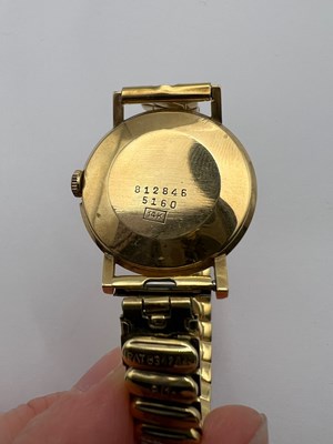 Lot 194 - A yellow precious metal bracelet watch, the...