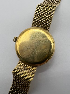 Lot 194 - A yellow precious metal bracelet watch, the...