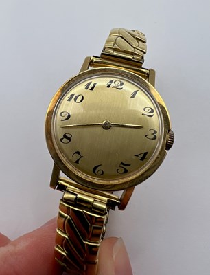 Lot 194 - A yellow precious metal bracelet watch, the...