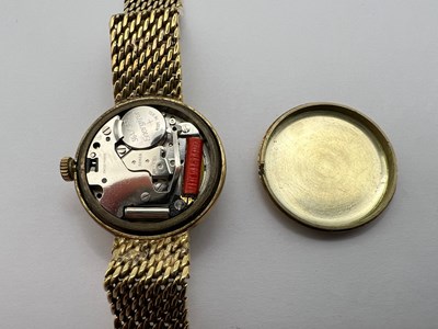 Lot 194 - A yellow precious metal bracelet watch, the...