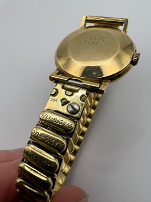 Lot 194 - A yellow precious metal bracelet watch, the...