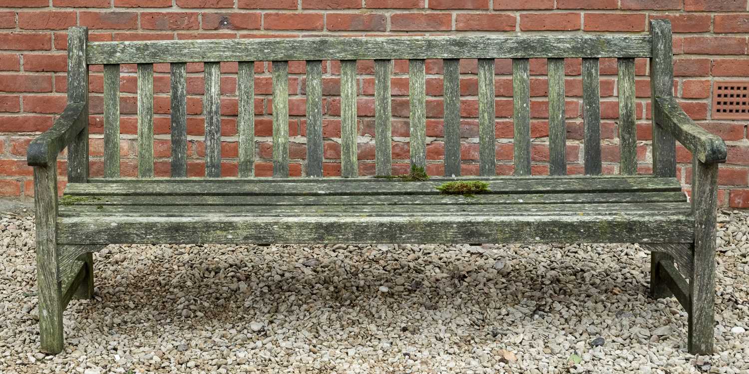 Lot 1095 - A teak garden bench