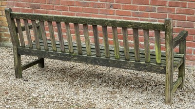 Lot 1095 - A teak garden bench