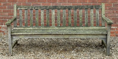 Lot 1118 - A teak garden bench