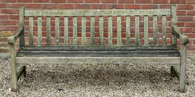 Lot 1153 - A teak garden bench