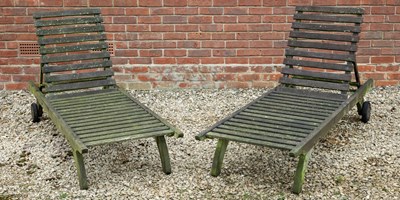 Lot 1146 - A pair of teak sunloungers