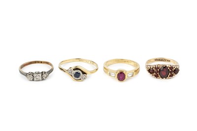 Lot 256 - A ruby and diamond three stone ring, the oval...